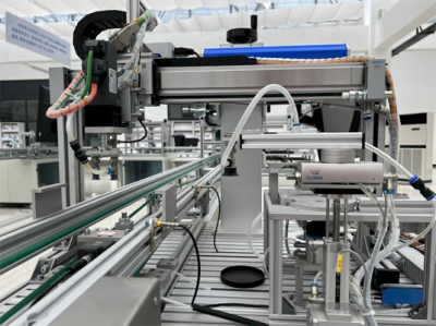 : A closeup image of machinery used in manufacturing assembly lines.